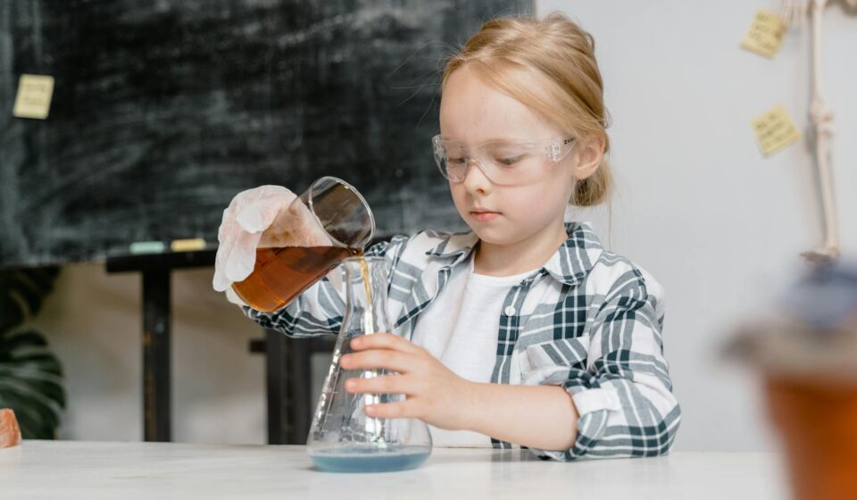 child performing science experiment