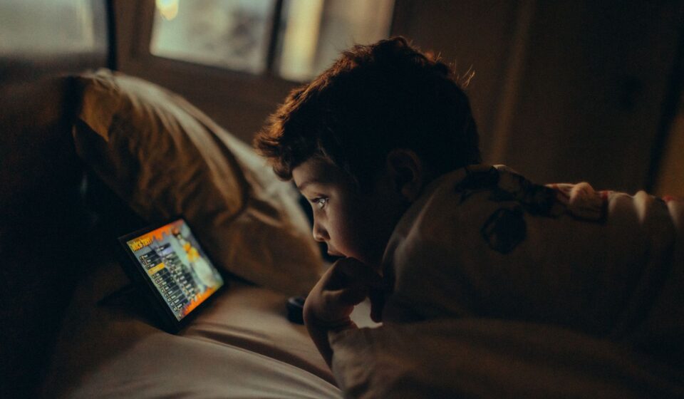 child watching tablet screen