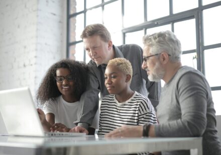 diverse professionals collaborating online