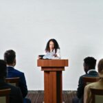 scientist talking to diverse audience