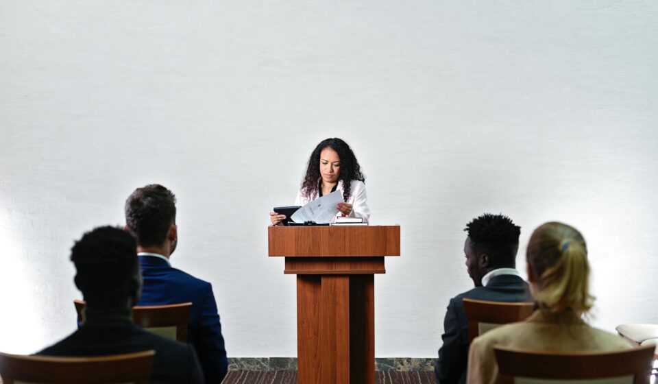 scientist talking to diverse audience